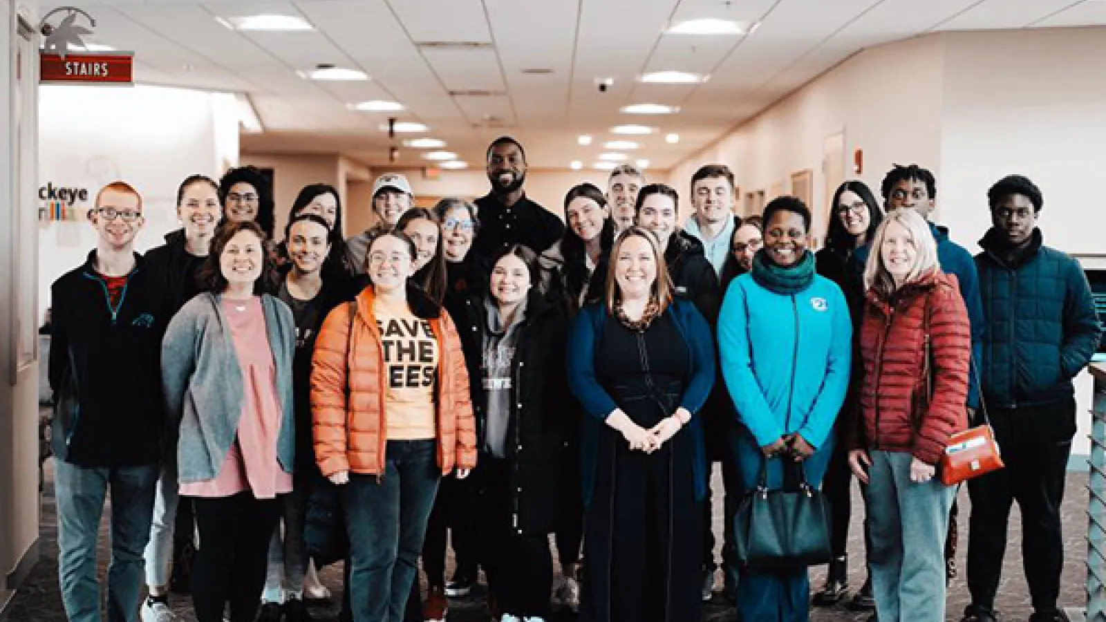 Group photo of students and faculty with Michael Kidd Gilchrist