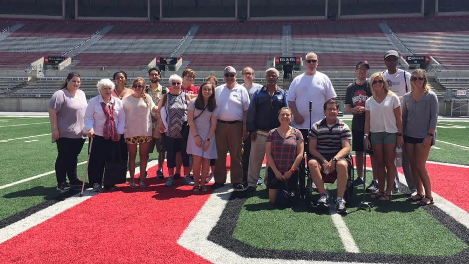 Group photo on 50 yard line of Ohio Stadium