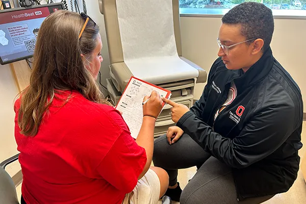 Patient receiving screening with Cheyenne Marshall